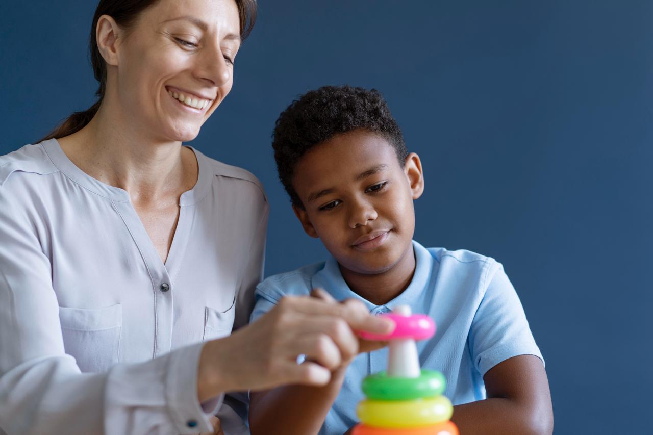 NDIS therapeutic support worker doing play-based activity with child participant Melbourne, ThriveWell Care therapeutic support and daily living skills for children Victoria